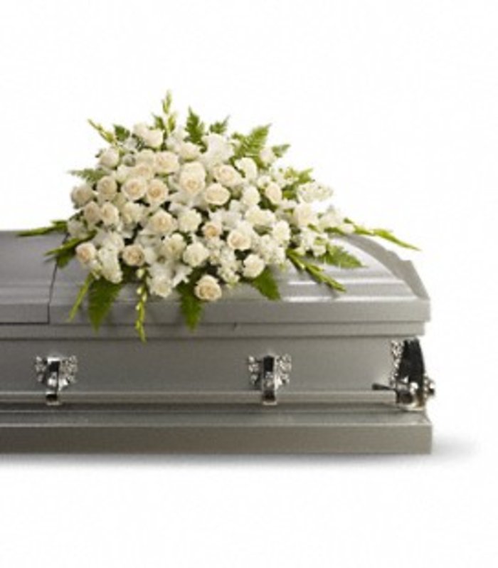 white and cream casket cover